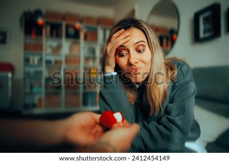 
Woman Receiving Engagement Ring Feeling in Doubt about the Proposal. 
Stressed woman refusing a gift from a suitor 
