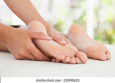 Woman Receiving A Foot Massage At The Health Spa