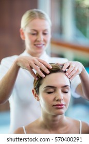 Woman Receiving A Head Massage At Spa