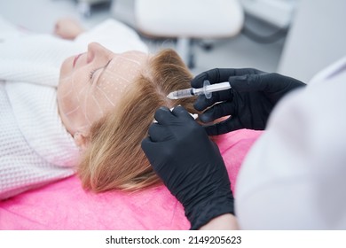 Woman Receiving Injection Into Scalp During Mesotherapy Treatment