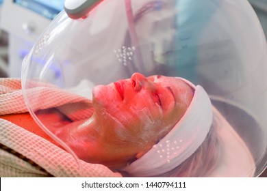 Woman Receiving LED Facial Therapy For Face.