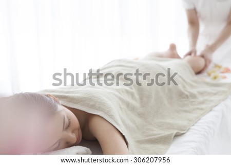 Woman receiving a leg and foot massage