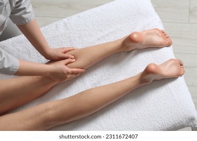 Woman receiving leg massage in spa salon, closeup - Powered by Shutterstock