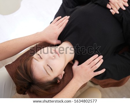 Woman receiving a massage at a Japanese manipulative institute