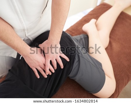 Woman receiving a massage at a Japanese manipulative institute