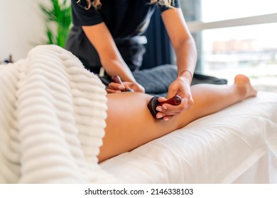 Woman Receiving A Massage From Wood Therapy