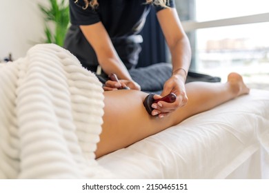 Woman Receiving A Massage From Wood Therapy