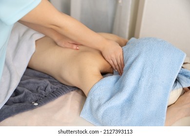 A Woman Receiving A Neck Massage At An Esthetic Salon