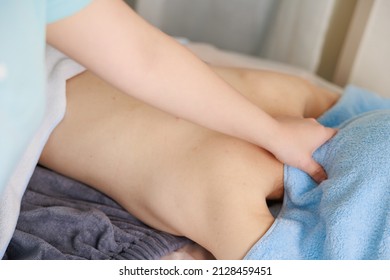 A Woman Receiving A Neck Massage At An Esthetic Salon