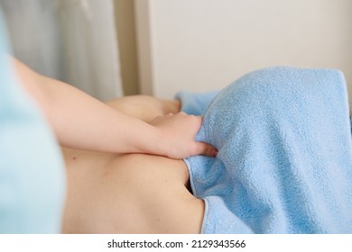 A Woman Receiving A Neck Massage At An Esthetic Salon