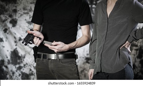 Woman Receiving One-on-one Firearms Training From Instructor. Concealed Carry, And Personal Defense Concept.