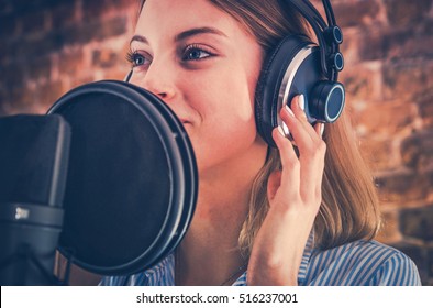 Woman Recording Audiobook. Audio Recording Studio Theme. Caucasian Voice Talent.