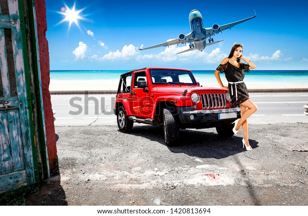 woman with red car and airplane\
on summer road. Free space for your decoration. Summer time\
