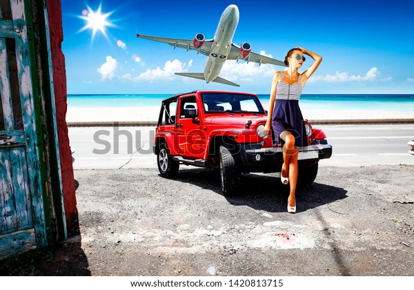 woman with red car and airplane
on summer road. Free space for your decoration. Summer time
