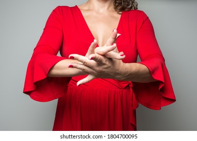 woman in red dress moving hands flamenco sevillanas touches palms - Shutterstock ID 1804700095