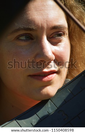 Similar – a woman lies on a green sofa. resting.