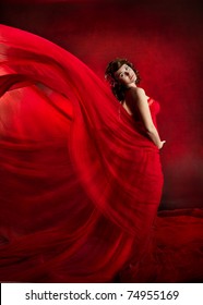 Woman In Red Dress Waving Flying On Wind Flow, Fashion Beauty Model Posing In Flowing Cloth