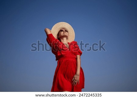 Similar – Image, Stock Photo Happy blonde woman with sunglasses and a hat enjoying the sun in nature