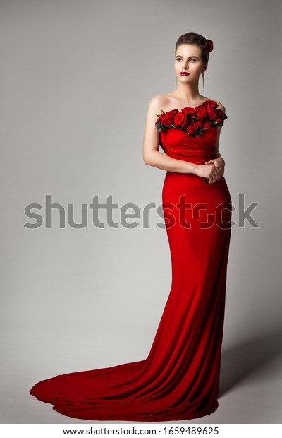 Woman in\
Red Evening Dress with Flowers Roses, Elegant Fashion Model Beauty\
Portrait in Long Gown, Studio\
Portrait