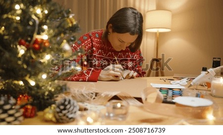 Similar – Image, Stock Photo Woman carefully cutting paper design in studio
