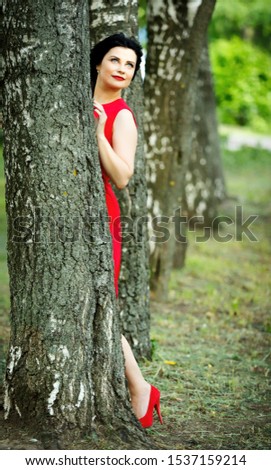 Similar – Foto Bild Rot gekleidete Frau, die im Wald meditiert.