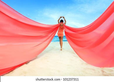 Woman With Red Scarf On The Beach