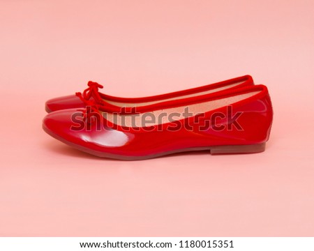 Woman red shoes isolated on the pink background