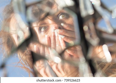 Woman Reflection In Broken Mirror