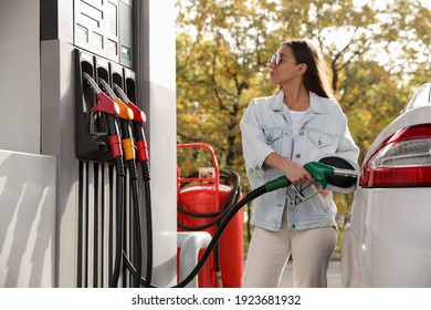 Woman Refueling Car At Self Service Gas Station