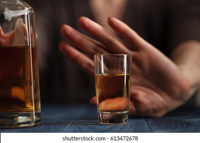 woman refused a glass of whiskey