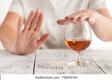 woman refuses to drink a alcohol - Shutterstock ID 718245763