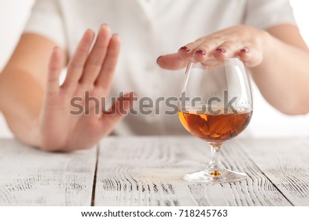 woman refuses to drink a alcohol