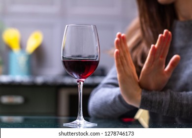 Woman Refuses To Drink A Alcohol. Female Alcoholism Concept. Treatment Of Alcohol Addiction. Quit Booze And Alcoholism.