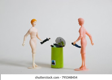 Woman Rejects Man By Tossing Him In The Trash. Online Dating Concept Or Bad Boss Situation. Rejection Or Refusal Between The Genders. Get Rid Of Bad Relationships And Dysfunction In The New Year. 