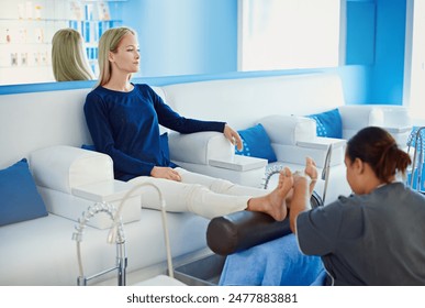 Woman, relax and foot massage with therapist for pedicure, beauty treatment or relaxation at beauty spa. Female person, masseuse or beautician on feet in skincare, pamper or physical therapy at salon - Powered by Shutterstock