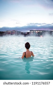 Woman relaxes and enjoys of spa in hot spring Blue Lagoon in Iceland - Shutterstock ID 1191176557