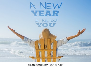 Woman Relaxing In Deck Chair By The Sea Against New Year New You