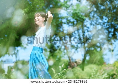 Woman relaxing in green space