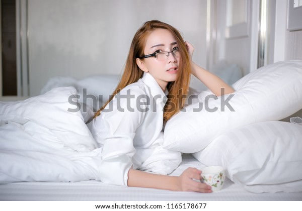 Woman Relaxing Home On Bed Young Stock Photo Edit Now 1165178677