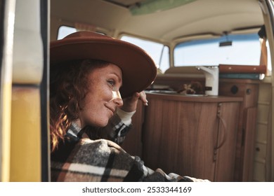  Woman Relaxing Inside Camper Van Looking Out Window - Powered by Shutterstock