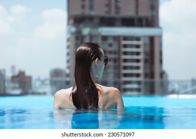 Woman Relaxing In Luxury Resort