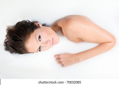 Woman Relaxing In Milk Bath