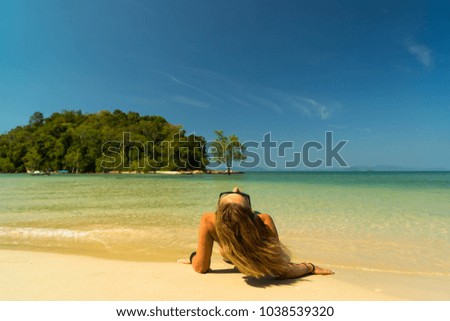 Woman relaxing on the beach in Krabi 