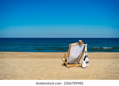 Woman relaxing on beach sitting on sunbed 
