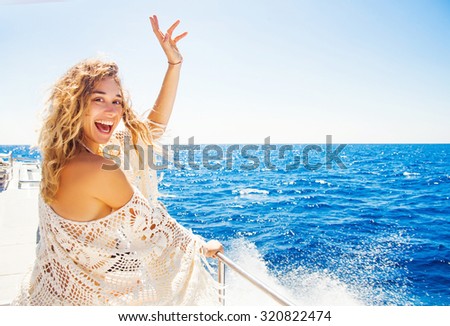 woman relaxing on a cruise boat on windy sunny day