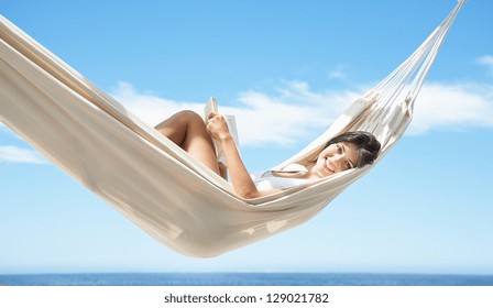 Woman Relaxing On Hammock