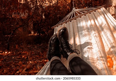 Woman Relaxing On A Hammock In An Autumn Garden.POV. 