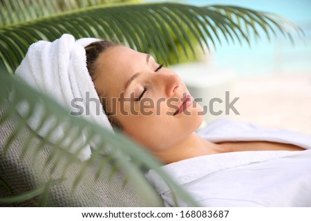 Woman relaxing outside spa resort