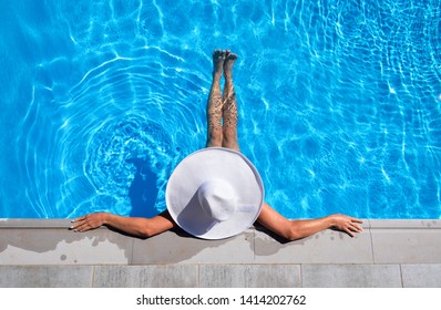 Woman is relaxing in the pool