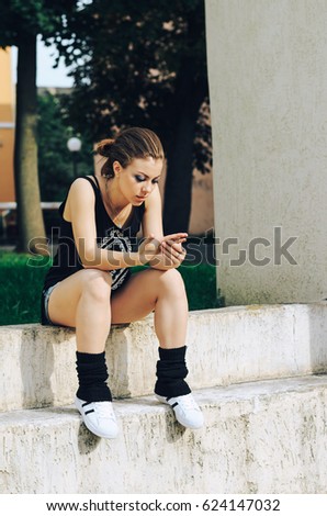 Woman relaxing and sitting on bench park